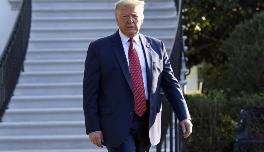 President Donald Trump walks over to talk with reporters on the South Lawn of the White House in Washington, Sunday, Sept. 22, 2019, as he prepares to board Marine One for the short trip to Andrews Air Force Base. Trump is traveling to Texas and Ohio before heading to New York for the upcoming United Nations General assembly. (AP Photo/Susan Walsh)