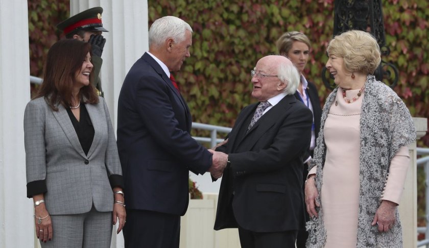 US Vice President Mike Pence, center left, with his wife Karen shakes hands with Irish President Michael D. Higgins, with wife Sabina, right, after a meeting in Dublin, Tuesday, Sept. 3, 2019. Pence is on an official visit to Ireland. (Liam McBurney/PA via AP)