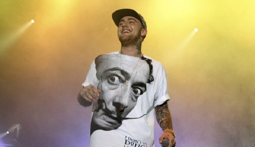 FILE - In this July 13, 2013, file photo, rapper Mac Miller performs on his Space Migration Tour in Philadelphia. A man has been charged with selling counterfeit opioid pills to Mac Miller two days before the rapper died of an overdose. An autopsy found that the 26-year-old Miller died in his Los Angeles home on Sept. 7 from a combination of fentanyl, cocaine and alcohol. (Photo by Owen Sweeney/Invision/AP, File)