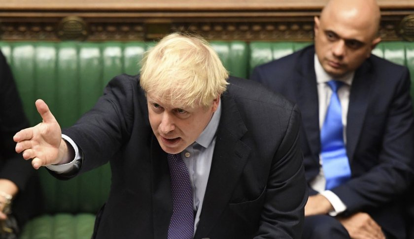 Britain's Prime Minister Boris Johnson gestures as he speaks in the House of Commons in London during the debate for the EU Withdrawal Agreement Bill, Tuesday Oct. 22, 2019. (Jessica Taylor, UK Parliament via AP)