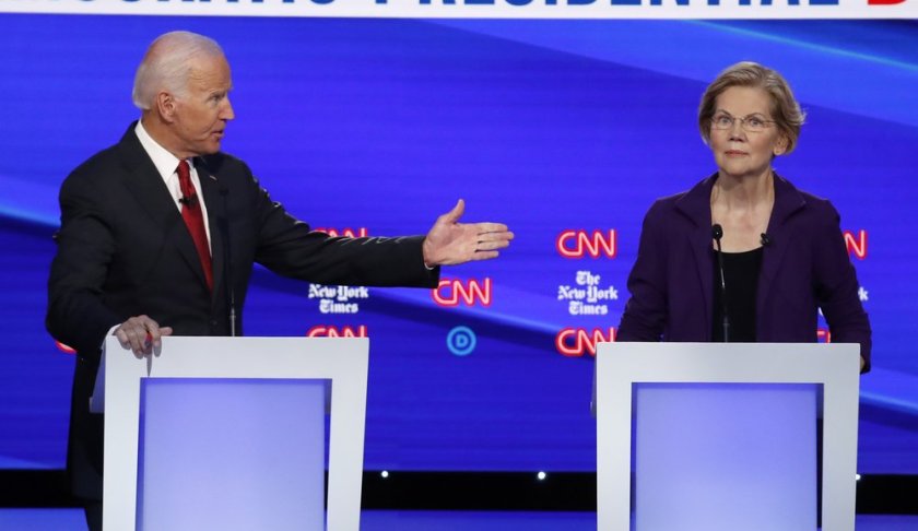 Democratic presidential candidate former Vice President Joe Biden, gestures toward Sen. Elizabeth Warren, D-Mass., during a Democratic presidential primary debate hosted by CNN/New York Times at Otterbein University, Tuesday, Oct. 15, 2019, in Westerville, Ohio. (AP Photo/John Minchillo)
