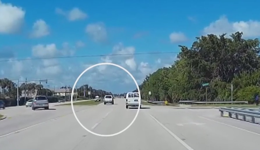 Deputy flahes his or her lights when a vehicle speeds on the adjacent roadway just feet away. (Credit: WINK News)