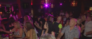 Hundreds gathered to dance, sing and donate to the victim, Evan Dowling, and his family at the Cavo Lounge in Mercato on Friday. (Credit: WINK News)