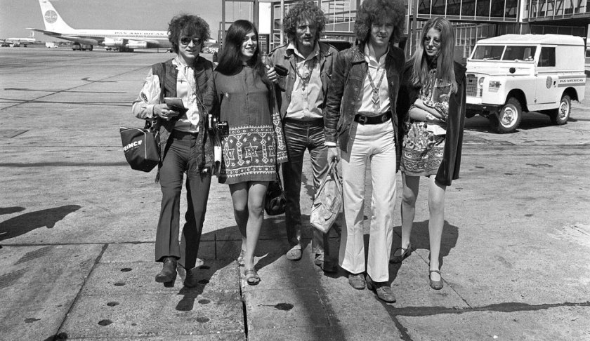 FILE - In this Aug. 20, 1967 file photo, members of the rock group Cream depart from Heathrow Airport in London, for their American tour. The trio, walking with unidentified female companions, from left are, base guitarist Jack Bruce, drummer Ginger Baker, and lead guitarist Eric Clapton. Baker, the volatile and propulsive British musician who was best known for his time with the power trio Cream, died Sunday, Oct. 6, 2019, at age 80, his family said. (AP Photo/Peter Kemp, File)