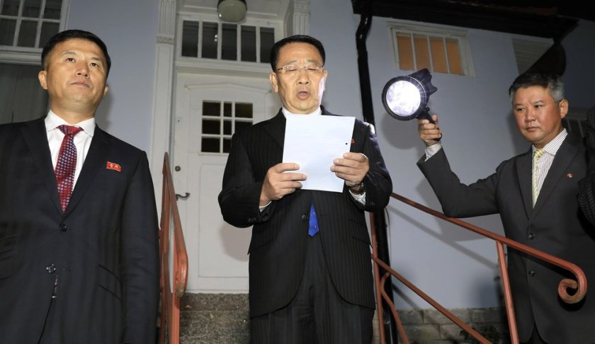 North Korean negotiator Kim Miyong Gil, center, reads statement outside the North Korean Embassy in Stockholm, Sweden, Saturday, Oct. 5, 2019. North Korea's chief negotiator said Saturday that discussions with the U.S. on Pyongyang's nuclear program have broken down, but Washington said the two sides had "good discussions" that it intends to build on in two weeks. (Kyodo News via AP)
