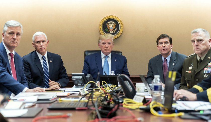 In this image released by the White House, President Donald Trump is joined by Vice President Mike Pence, second from left, national security adviser Robert O’Brien, left; Secretary of Defense Mark Esper, second from right, and Chairman of the Joint Chiefs of Staff Army Gen. Mark A. Milley, right, Saturday, Oct. 26, 2019, in the Situation Room of the White House monitoring developments in the U.S. Special Operations forces raid that took out Islamic State leader Abu Bakr al-Baghdadi.. (Shealah Craighead/White House via AP)