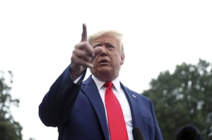 President Donald Trump speaks to members of the media on the South Lawn of the White House in Washington, Thursday, Oct. 3, 2019, before boarding Marine One for a short trip to Andrews Air Force Base, Md., and then on to Florida. (AP Photo/Andrew Harnik)