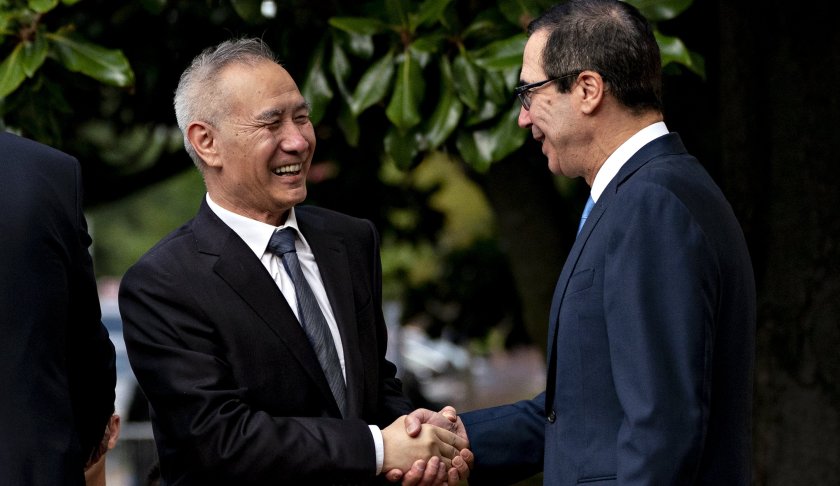 Liu He, China's vice premier, left, shakes hands with Steven Mnuchin, U.S. Treasury secretary, while arriving for a meeting at the Office of the U.S. Trade Representative in Washington, D.C. (Credit: CNN)