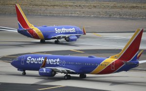 FILE - This July 17, 2019 photo shows Southwest Airlines planes at Phoenix Sky Harbor International Airport in Phoenix. (AP Photo/Ross D. Franklin, File)