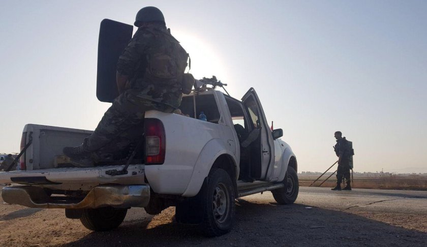 In this photo released by the Syrian official news agency SANA, Syrian troops deploy in the northern town of Tal Tamr, Monday, Oct 14, 2019. The move toward Tal Tamr came a day after Syria's Kurds said Syrian government forces agreed to help them fend off Turkey's invasion — a major shift in alliances that came after President Donald Trump ordered all U.S. troops withdrawn from the northern border area amid the rapidly deepening chaos. (SANA via AP)