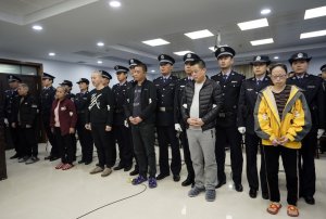 A trial continues as fentanyl drug traffickers are sentenced in court, Thursday, Nov. 7, 2019, in Xingtai, north China's Hebei Province. The court sentenced at least nine fentanyl traffickers Thursday in a case that was a culmination of a rare collaboration between Chinese and U.S. law enforcement to crack down on global networks that manufacture and distribute lethal synthetic opioids. (Jin Liangkuai/Xinhua via AP)