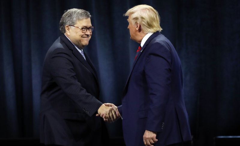 President Donald Trump shakes hands with Attorney General William Barr before Trump signed an executive order creating a commission to study law enforcement and justice at the International Association of Chiefs of Police Convention Monday, Oct. 28, 2019, in Chicago. (AP Photo/Charles Rex Arbogast)