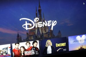 FILE - In this Wednesday, Nov. 13, 2019 file photo, a Disney logo forms part of a menu for the Disney Plus movie and entertainment streaming service on a computer screen in Walpole, Mass. Disney Plus says it doesn’t have a security breach, but some users of the new streaming service have been shut out after hackers tried to break into their accounts. (AP Photo/Steven Senne, File)