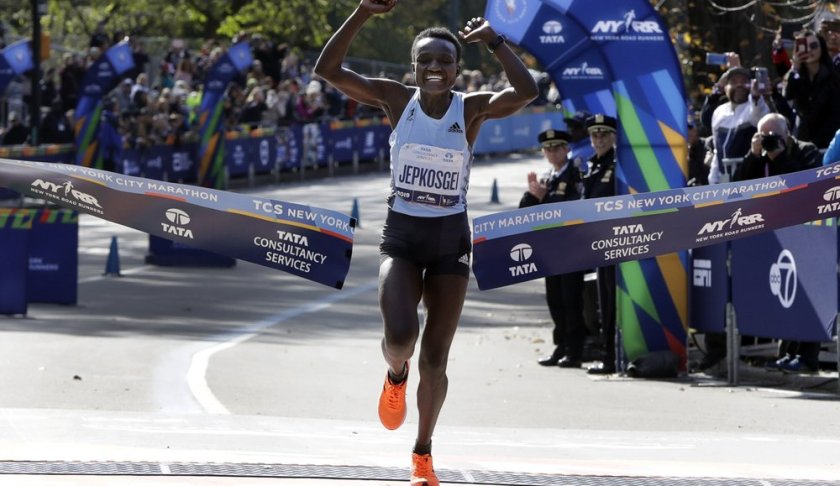 Joyciline Jepkosgei, of Kenya, crosses the finish line to win the Pro Women's Division of the New York City Marathon, in New York's Central Park, Sunday, Nov. 3, 2019. (AP Photo/Richard Drew)