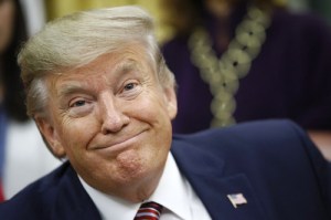 President Donald Trump participates in a bill signing ceremony for the Women's Suffrage Centennial Commemorative Coin Act in the Oval Office of the White House, Monday, Nov. 25, 2019, in Washington. (AP Photo/Patrick Semansky)