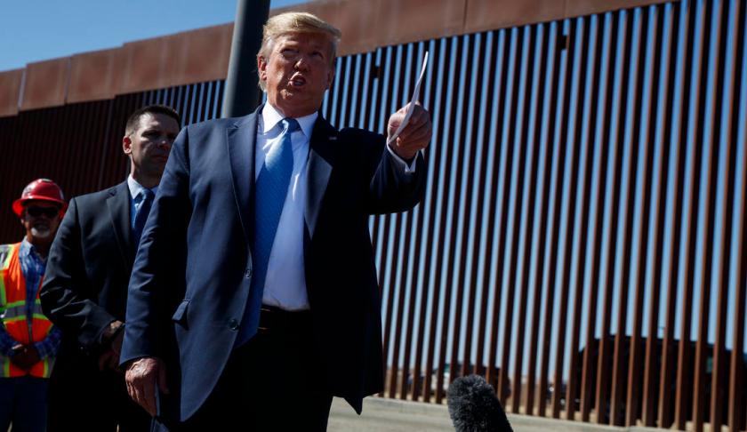 Smugglers are swing through the border wall. (Credit: AP)