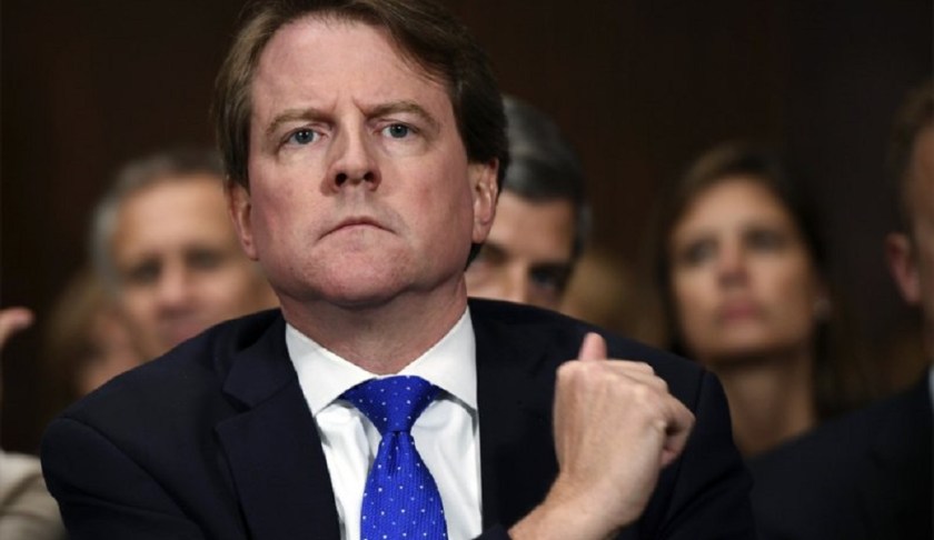 FILE - In this Sept. 27, 2018, file photo, then-White House counsel Don McGahn listens as Supreme court nominee Brett Kavanaugh testifies before the Senate Judiciary Committee on Capitol Hill in Washington. A federal judge has ordered McGahn to appear before Congress in a setback to President Donald Trump’s effort to keep his top aides from testifying. The outcome could lead to renewed efforts by House Democrats to compel testimony from other high-ranking officials, including former national security adviser John Bolton. (Saul Loeb/Pool Photo via AP, File)