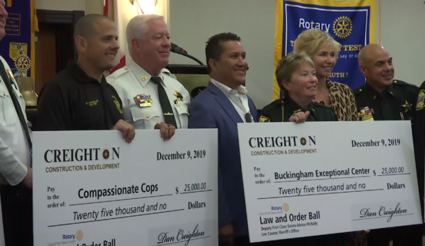 Among the winners of the Lee County Officer of the Year awards with checks allocate the prizes to their favorite charities. (Credit: WINK News)