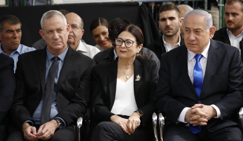 FILE - In this Sept. 19, 2019 file photo, Blue and White party leader Benny Gantz, left, Esther Hayut, the Chief Justice of the Supreme Court of Israel, center, and Israeli Prime Minister Benjamin Netanyahu attend a memorial service for former President Shimon Peres in Jerusalem. Barring a nearly unfathomable about face, Israel is headed Wednesday, Dec. 11 toward an unprecedented third election within a year - prolonging a political stalemate that has paralyzed government and undermined its citizens' faith in the democratic process. (AP Photo/Ariel Schalit, File)