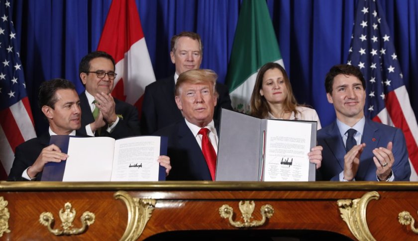 FILE: President Donald Trump, Canada's Prime Minister Justin Trudeau, right, and Mexico's President Enrique Pena Neto, left, participate in the USMCA signing ceremony, Friday, Nov. 30, 2018 in Buenos Aires, Argentina. (AP Photo/Pablo Martinez Monsivais/FILE)