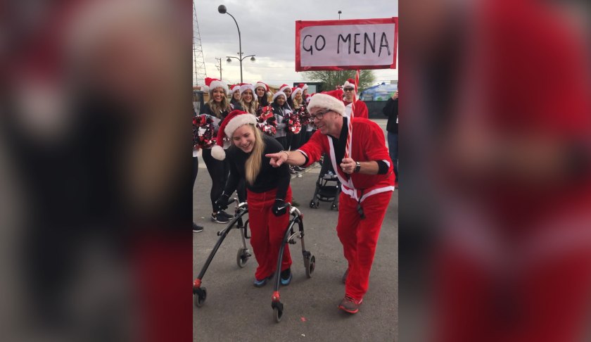 17-year-old Mena Hawkins with cerebral palsy walked across the finish line at the Las Vegas Great Santa Run. (Credit: Roger Hawkins)