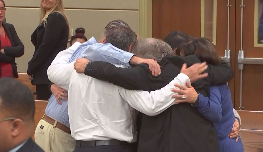 FILE: The family of Dr. Teresa Sievers embrace one another after a jury finds her husband, Mark Sievers, guilty of first-degree murder in her vicious killing at their Bonita Springs home in 2015. (Credit: WINK News./FILE)