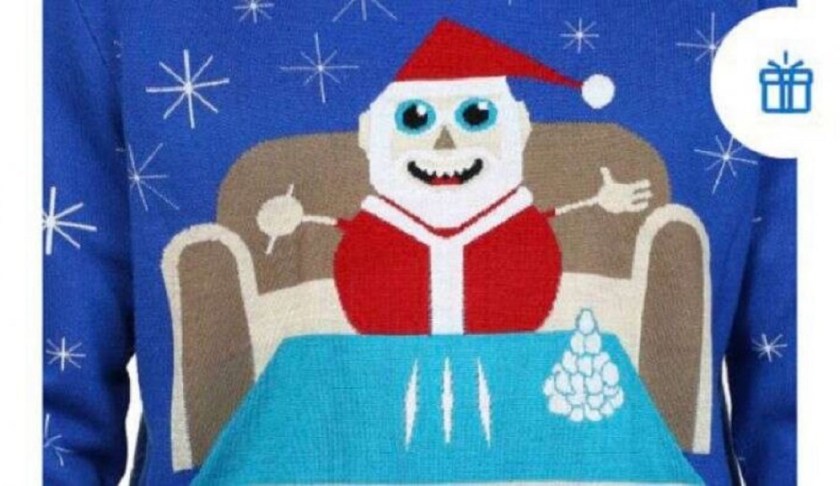 The sweater showed Santa with three lines of a white substance with the phrase let it snow. (Credit: Walmart)