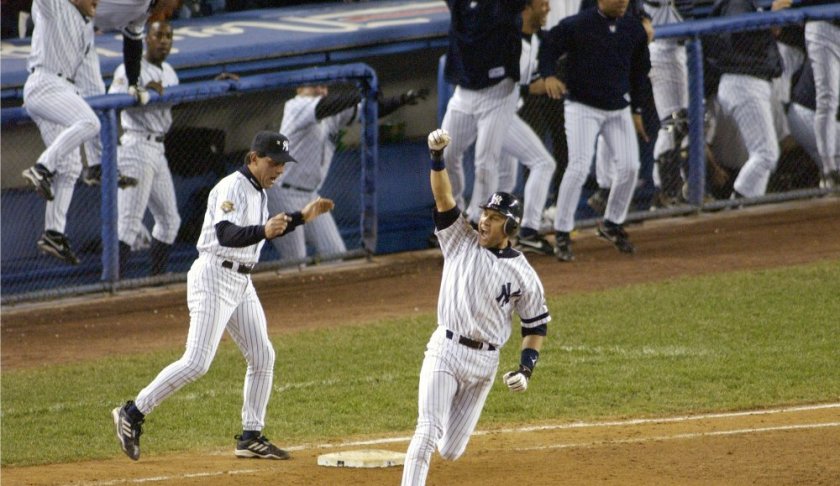 FILE - In this Oct. 31, 2001, file photo, New York Yankees' Derek Jeter celebrates his game-winning home run in the 10th inning as he rounds first base in Game 4 of baseball's World Series against the Arizona Diamondbacks at Yankee Stadium in New York. Jeter could be a unanimous pick when Baseball Hall of Fame voting is announced Tuesday, Jan. 21, 2020. (AP Photo/Bill Kostroun, File)