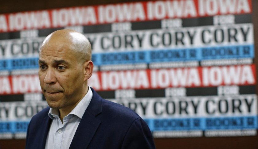 FILE - In this Jan. 9, 2020 file photo, Democratic presidential candidate Sen. Cory Booker, D-N.J., speaks with attendees after a campaign event in Mount Vernon, Iowa. Booker has dropped out of the presidential race after failing to qualify for the December primary debate. (AP Photo/Patrick Semansky)