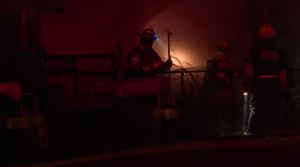 Firefighters fight the flames as the family's home burns down. (Credit: WINK News)