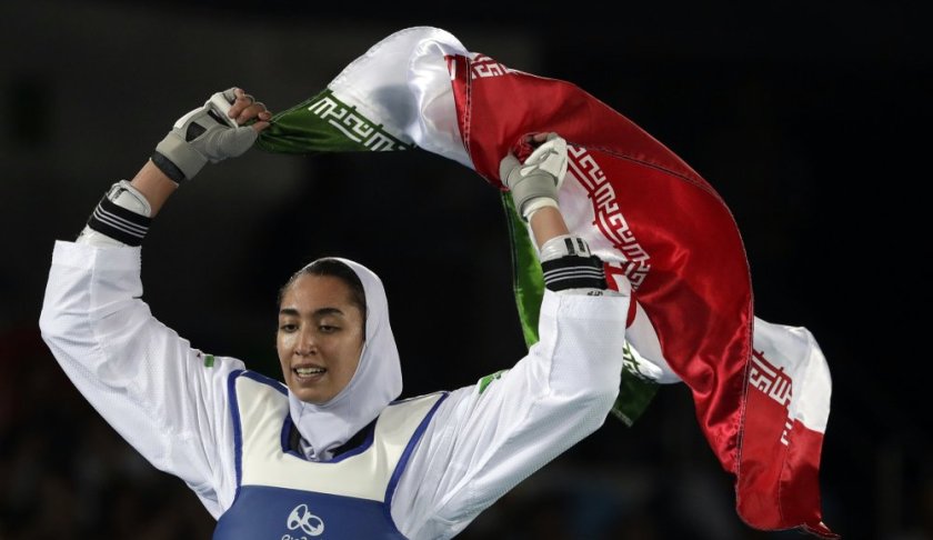 FILE - In this Aug. 18, 2016 file photo, Kimia Alizadeh Zenoorin of Iran celebrates after winning the bronze medal in a women's Taekwondo 57-kg competition at the 2016 Summer Olympics in Rio de Janeiro, Brazil. Zenoorin, Iran's only female Olympic medalist, said she defected from the Islamic Republic in a blistering online letter that describes herself as “one of the millions of oppressed women in Iran.” (AP Photo/Andrew Medichini, File)