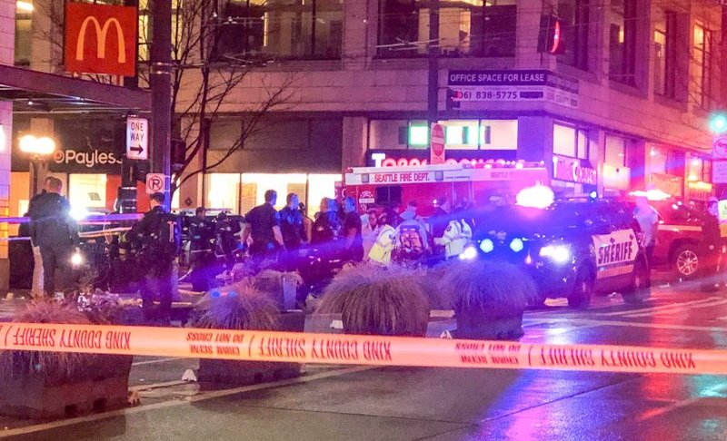 Police work the scene of a shooting on Third Avenue and Pine Street, Wednesday, Jan. 22, 2020, in Seattle. (Amanda Snyder/The Seattle Times via AP)