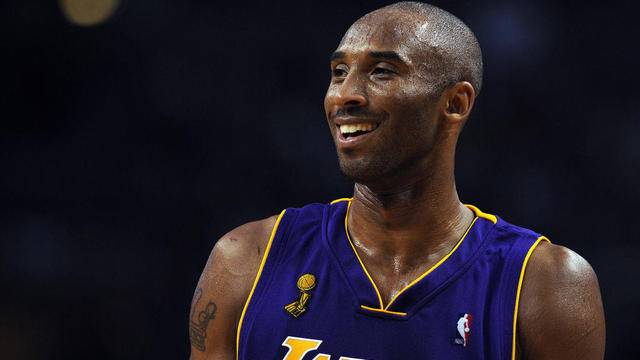 Why did Kobe Bryant change his shirt number, and how many NBA