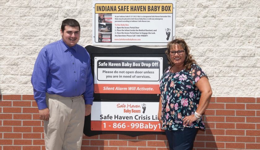 Hunter Wart, left, and Monica Kelsey, founder of Safe Haven Baby Boxes. Wart, 19, spent more than a year mowing lawns and scrapping metal to raise the $10,000 needed to purchase the Safe Haven Baby Box for the Seymour Fire Department. (Credit: John Wart, Jr. via CNN)