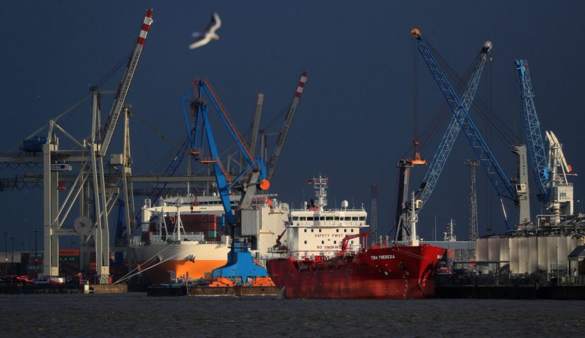 Chemical and oil tanker Tina Theresa, right, sits docked near shipping cranes at the port of Hamburg in Hamburg, Germany, on Wednesday, Feb. 12, 2020. Germany's biggest bank has given the strongest warning yet that the nation is close to a recession as the coronavirus outbreak exacerbates its long-running industrial slump. Photographer: Krisztian Bocsi/Bloomberg via Getty Images