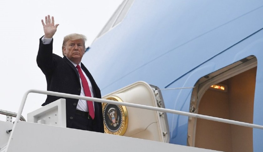 President Donald Trump waves from the top of the steps of Air Force One at Andrews Air Force Base in Md., Friday, Jan. 31, 2020. Trump is heading to Florida to spend the weekend at their Mar-a-Lago estate. (AP Photo/Susan Walsh)