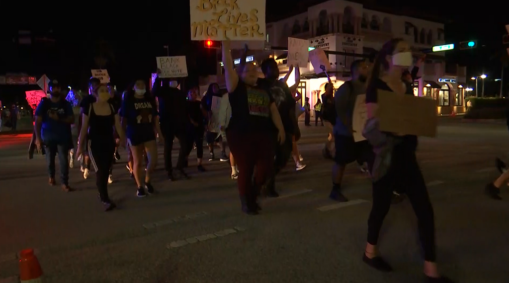 Over 1,000 protesters gather in East Naples, hundreds march downtown ...