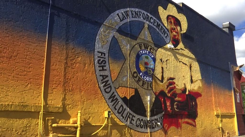 Artists, community honor fallen officer with mural in LaBelle