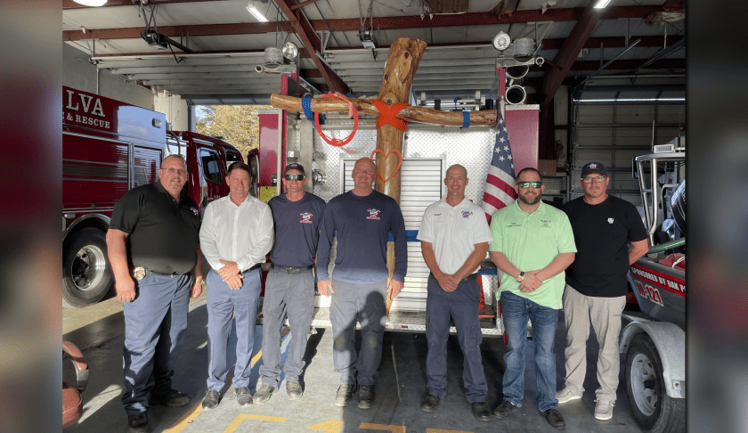 alva firefighters install cross