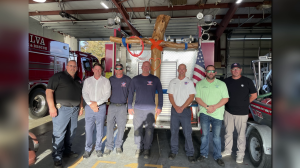 alva firefighters install cross