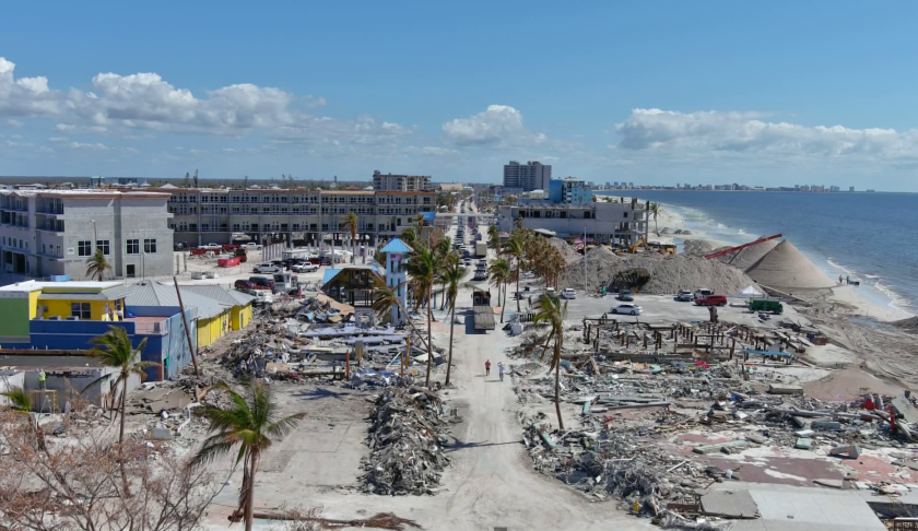 Fort Myers Beach cleans up together after Milton