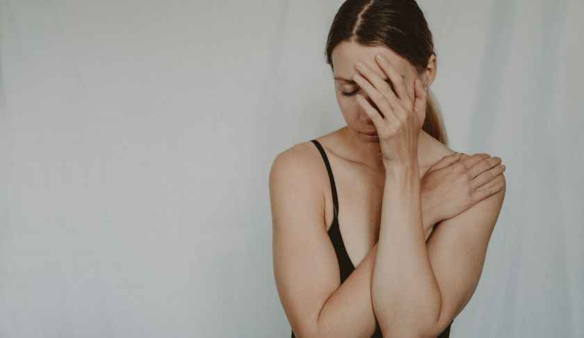 young sad woman with closed eyes