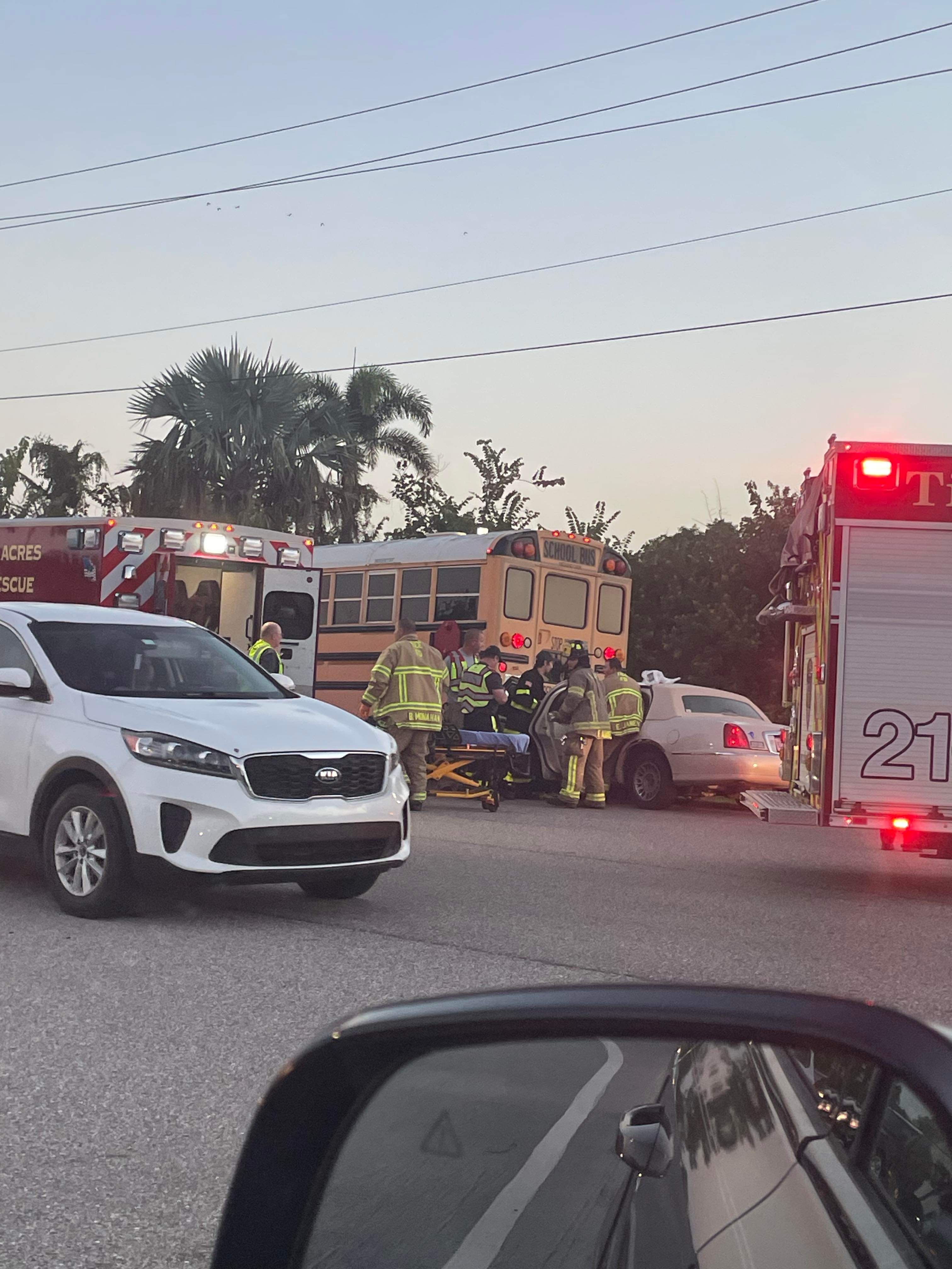 Crash Involving Car Wedged Under School Bus Leaves 1 Person Hurt