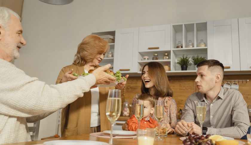 woman in white sweater sitting beside woman in white sweater