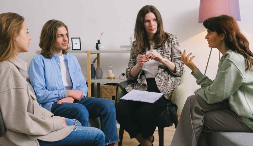 woman discussing problem during group therapy