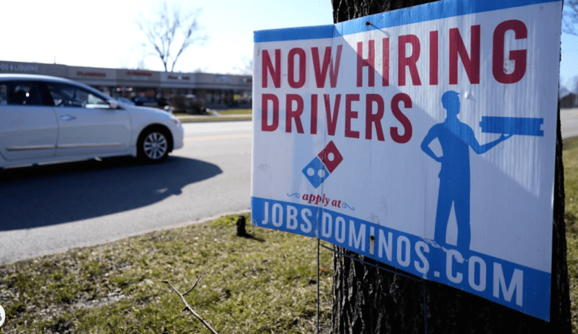 A hiring sign is posted outside of a Domino’s restaurant in Wheeling, Ill., Monday, Jan. 29, 2024. On Tuesday, the Labor Department reports on job openings and labor turnover for December. (AP Photo/Nam Y. Huh)