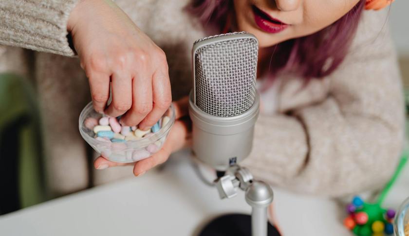 a woman recording an asmr audio using medicines