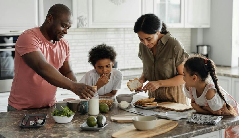 family making breakfast in the kitchen