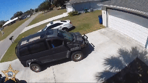 A clip of a man slamming into a deputy's garage just before firing shots inside. CREDIT: WINK News