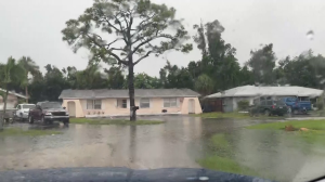 Fort Myers flooding around houses. CREDIT: WINK News